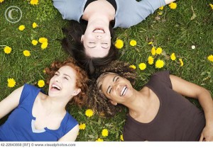 Women lying in the grass